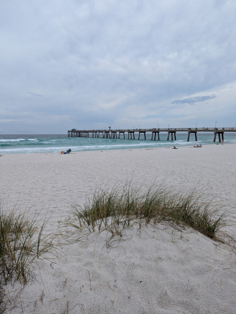 Fishing pier and white sand dunes on the Emerald Coast