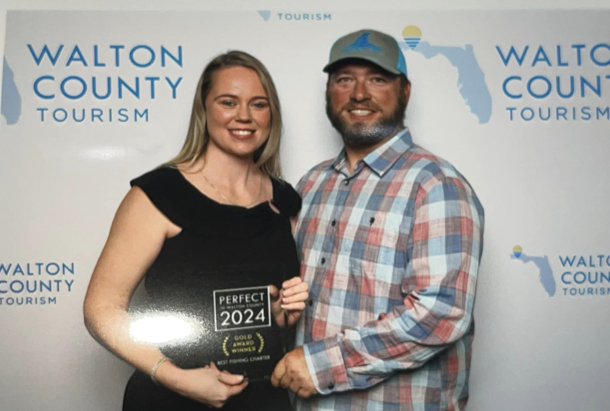 Choctawhatchee Bay Fishing Charters crew accepting a Perfect in South Walton fishing charter award