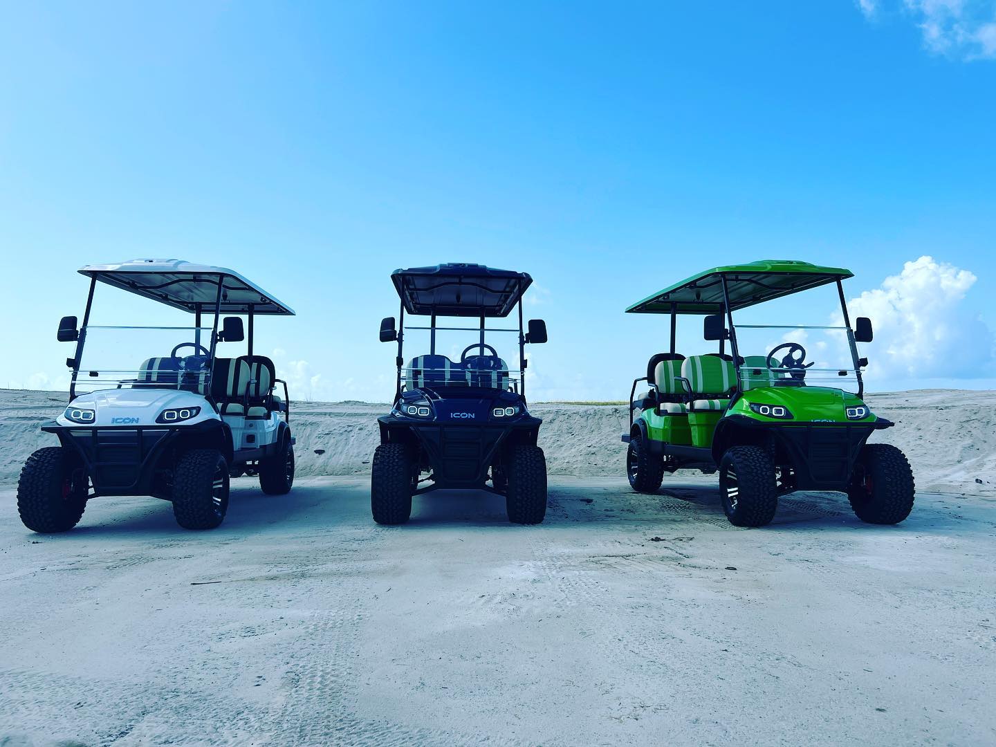 Kayaks and paddleboards staged for rental delivery by Navarre-SUP on Navarre Beach