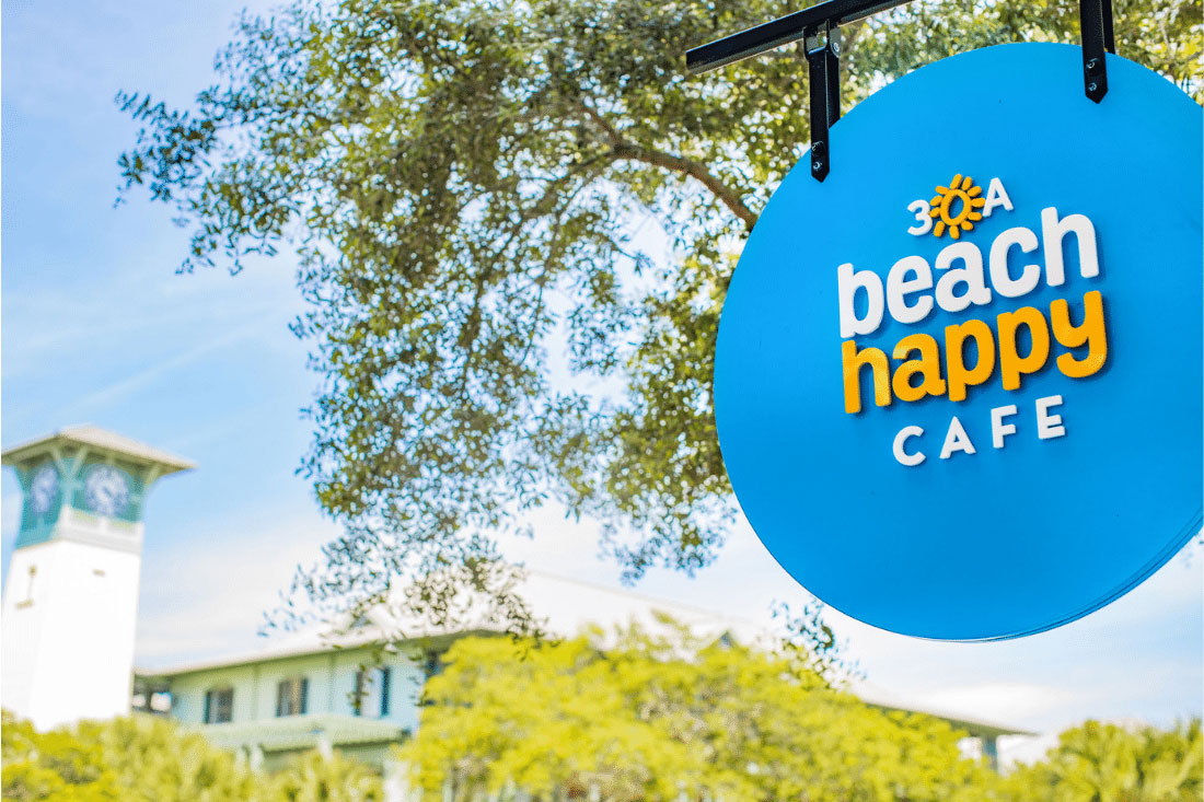 Exterior sign at Beach Happy Cafe in WaterColor Town Center