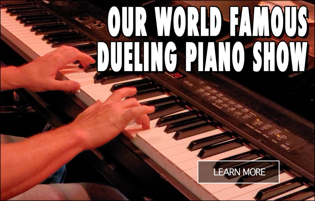 Dueling piano performers entertaining the crowd at Rum Runners
