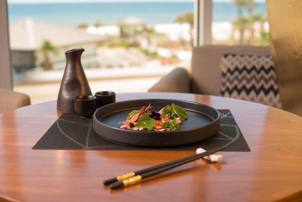 Photo from the Bonsai restaurant website showing the dining space above the Hilton Pensacola Beach