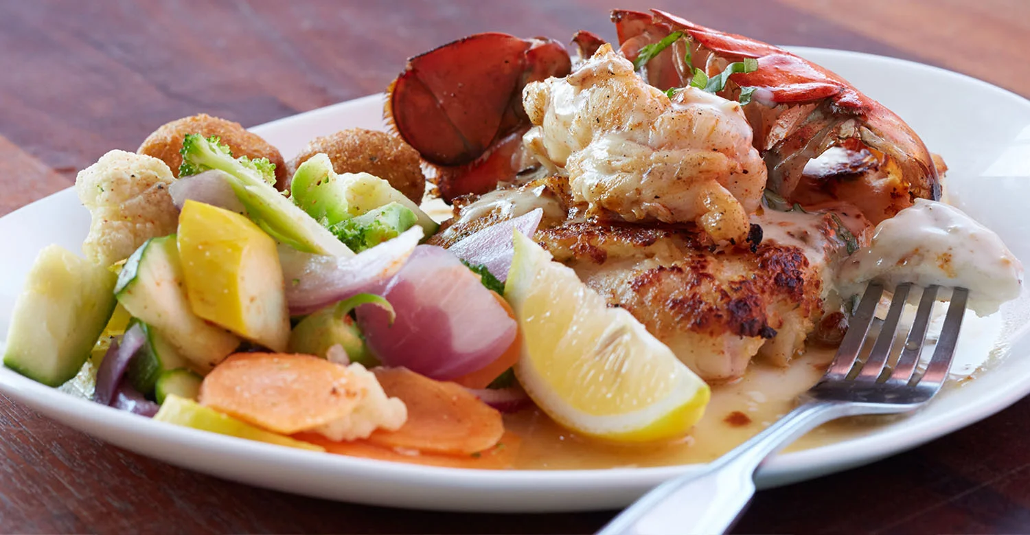 Garlic-crusted grouper topped with lobster at Pompano Joe's