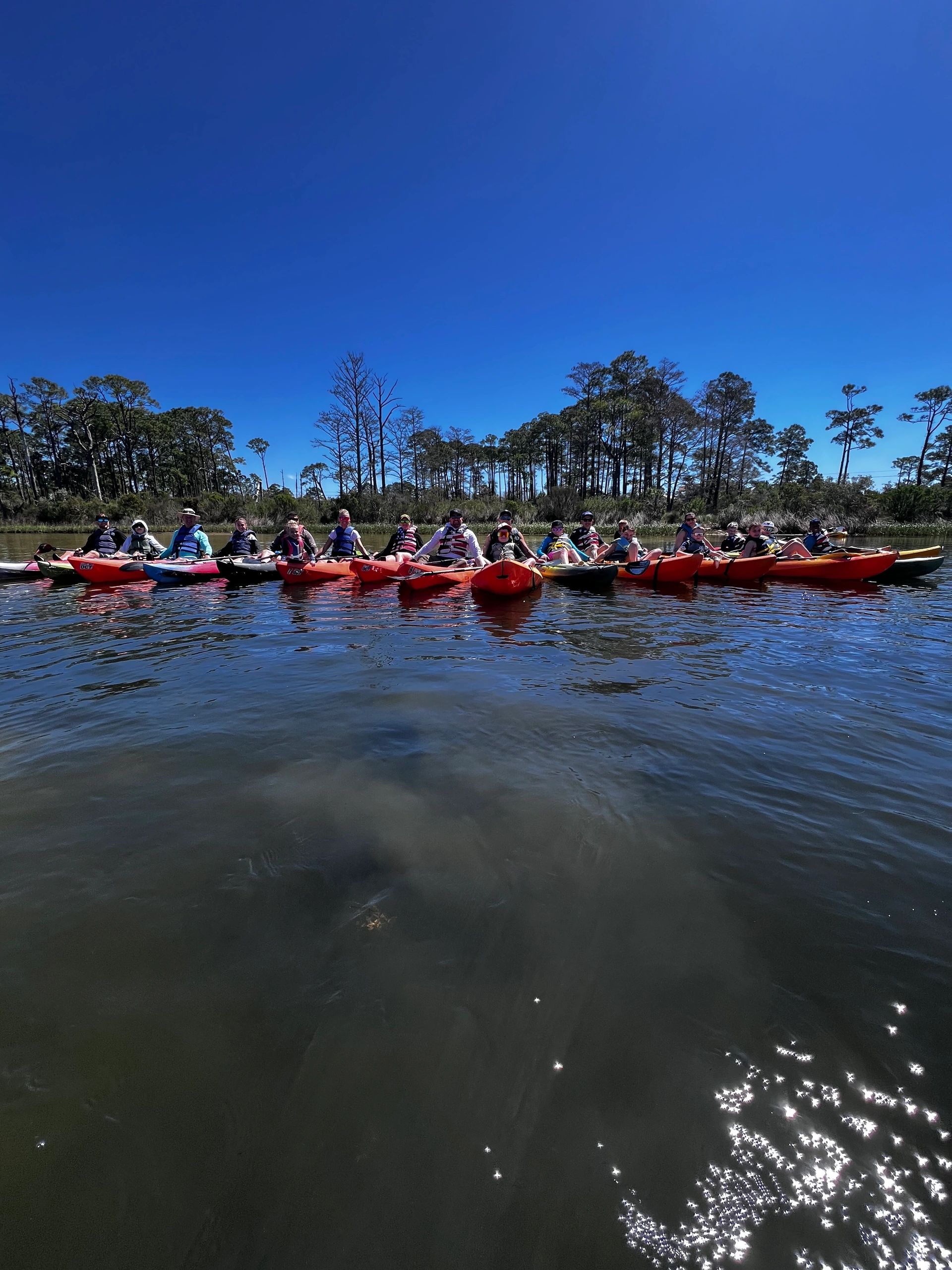 Group kayaking on calm water near Perdido Key with Littleheads Kayak Rentals