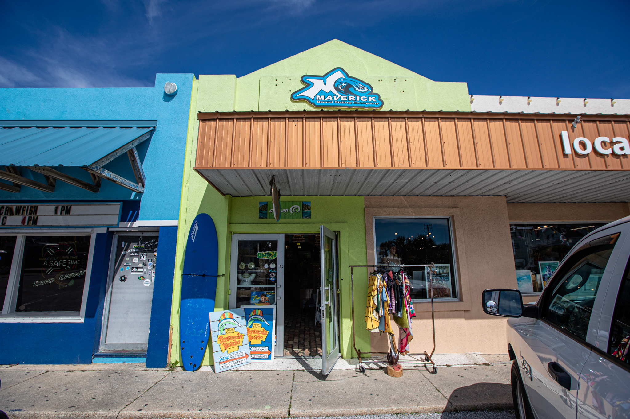 Surfboards and paddleboards on display at Maverick Board Riding Company on Pensacola Beach