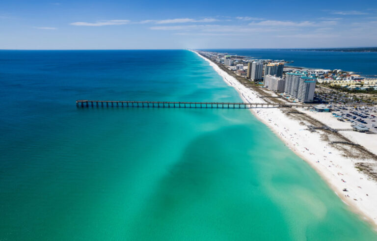 Aerial view of the Navarre Beach pier and emerald water
