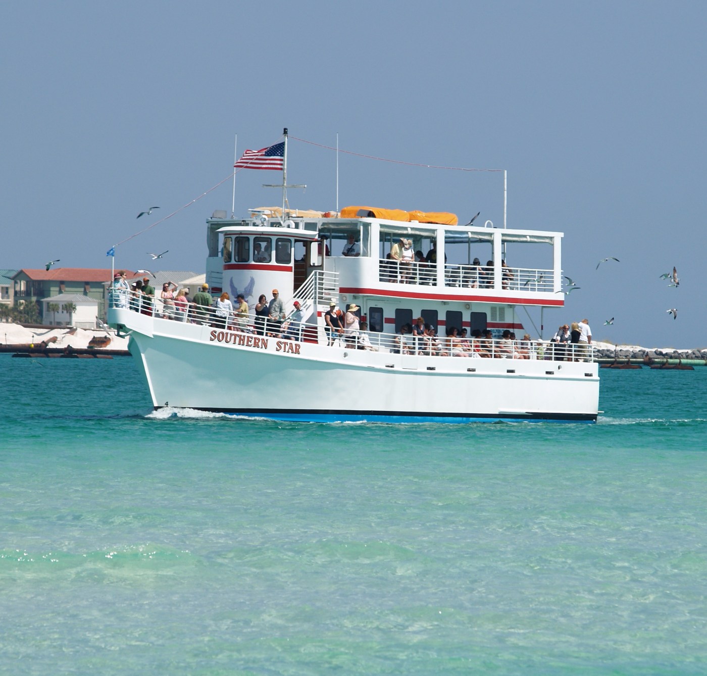Passengers aboard the Southern Star glass-bottom dolphin cruise boat in Destin Harbor