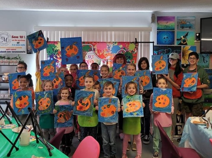 Guests enjoying a paint and sip class at Tipsy Canvas in Crestview, Florida