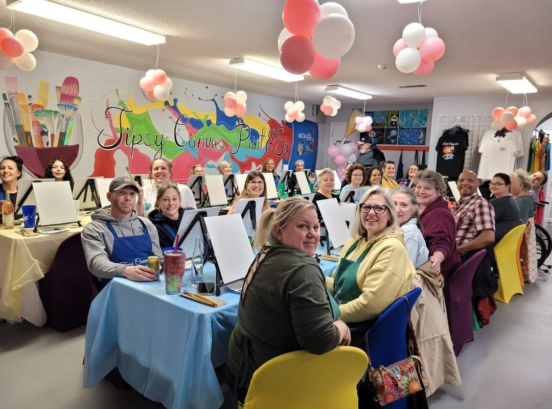 Finished canvas paintings from a session at Tipsy Canvas Paint & Sip