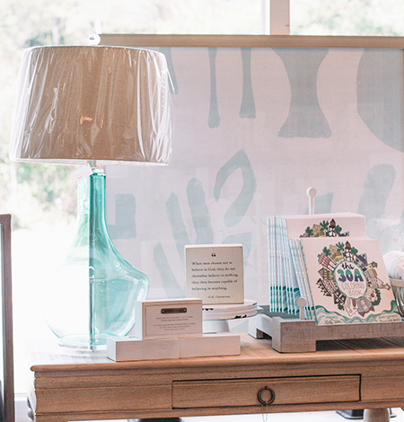 Home decor and gift display inside Lola's on 30A boutique in Santa Rosa Beach
