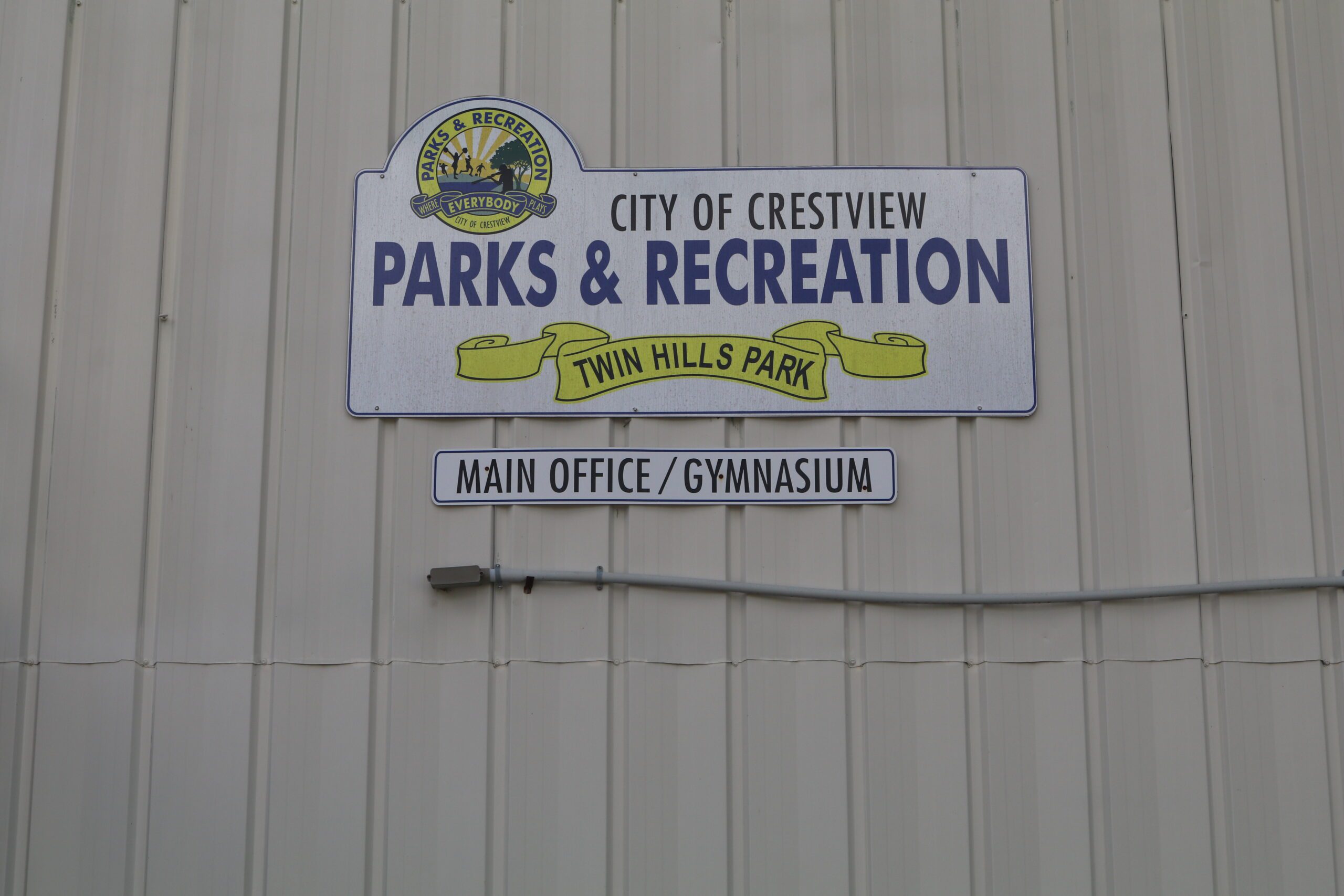 Families enjoying summer camp activities at Twin Hills Park in Crestview