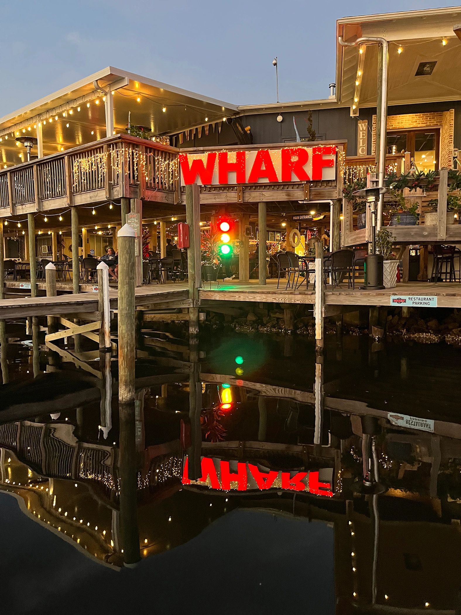 Boat docked at The Wharf 850 waterfront restaurant on Bayshore Drive in Niceville