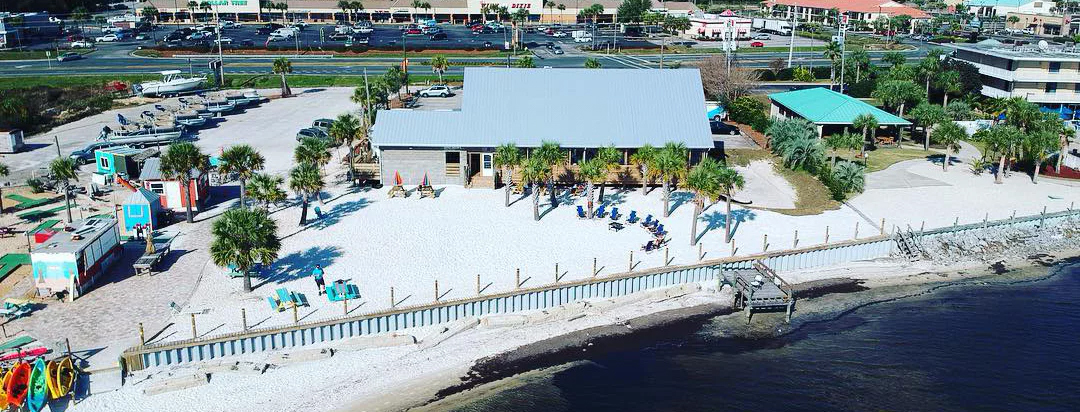Sound-side setting at Dewey Destin's Navarre next to the Navarre Beach Bridge