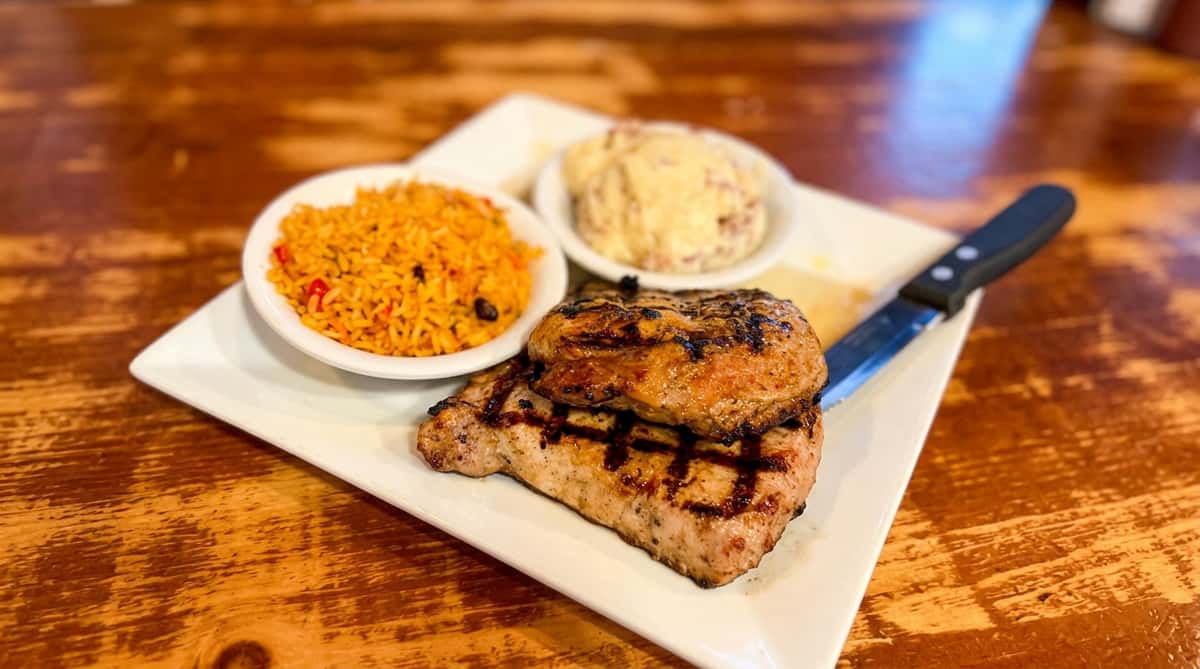 Grilled pork chop dish at Chanticleer Eatery