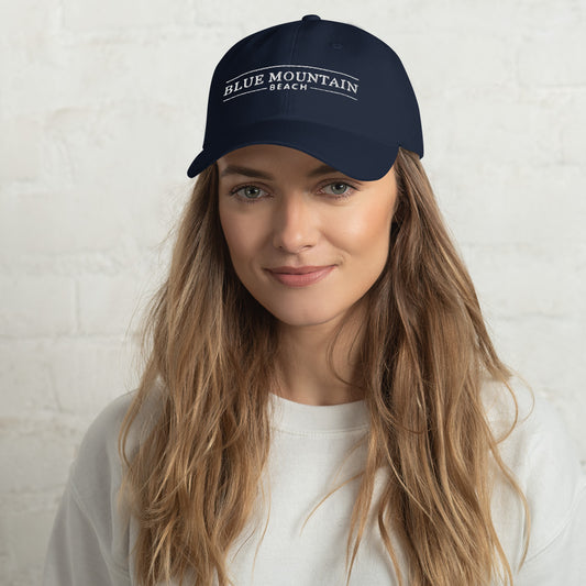 Navy dad hat with Blue Mountain Beach branding from Blue Mountain Beach Supply Co.