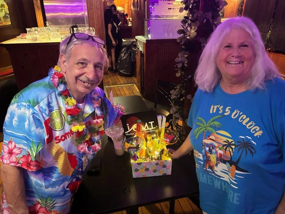 Private celebration aboard a Destin harbor cruise with tropical decorations