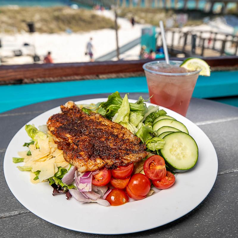 Green salad with fish served at Windjammers on the Pier