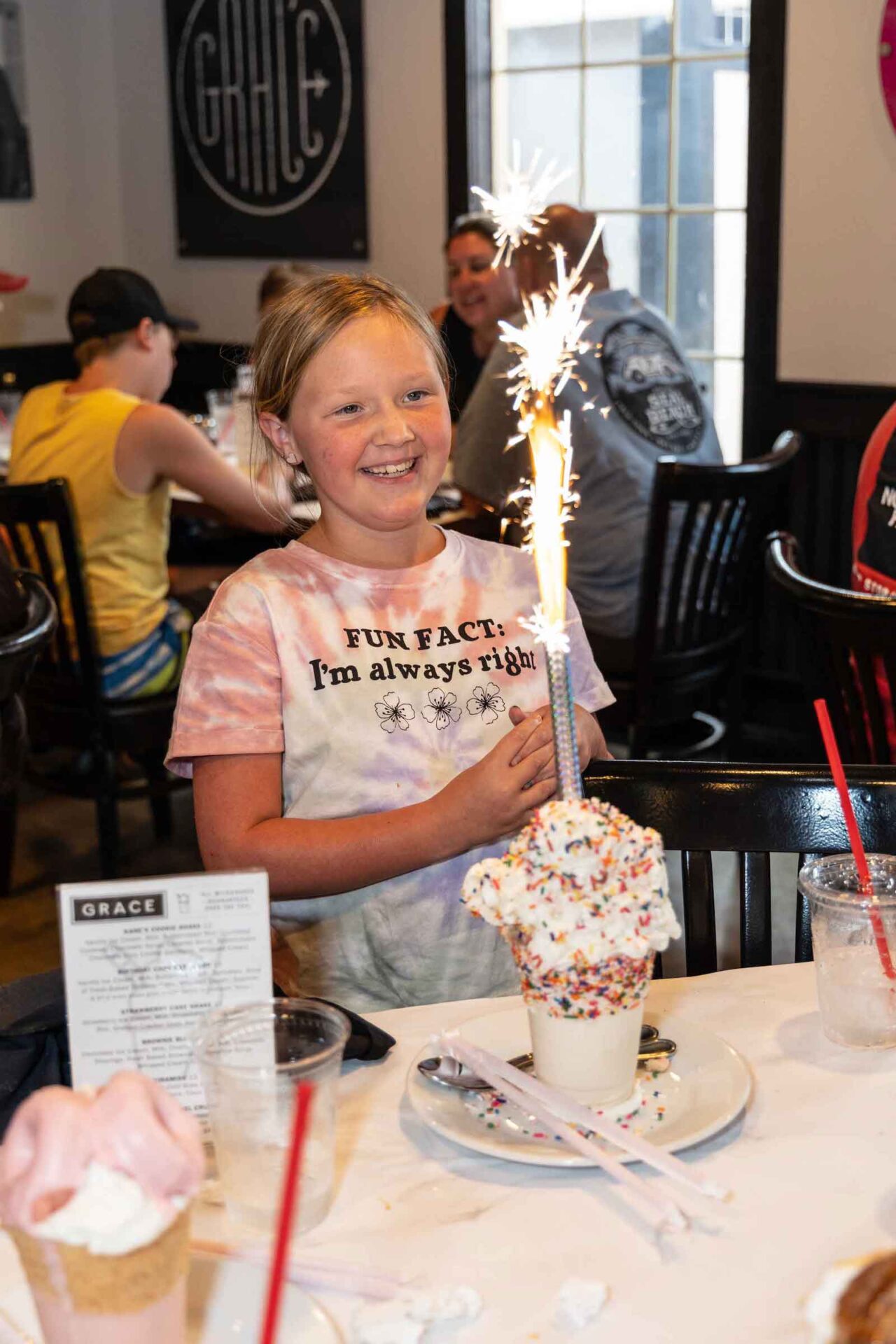 Family enjoying pizza at Grace Pizza and Shakes 30A in Grayton Beach