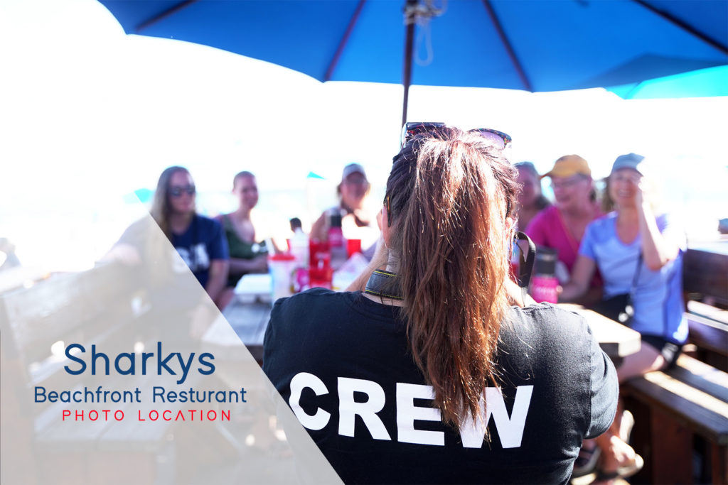 Beachfront view of Sharky's Beachfront Restaurant and its tiki hut in Panama City Beach