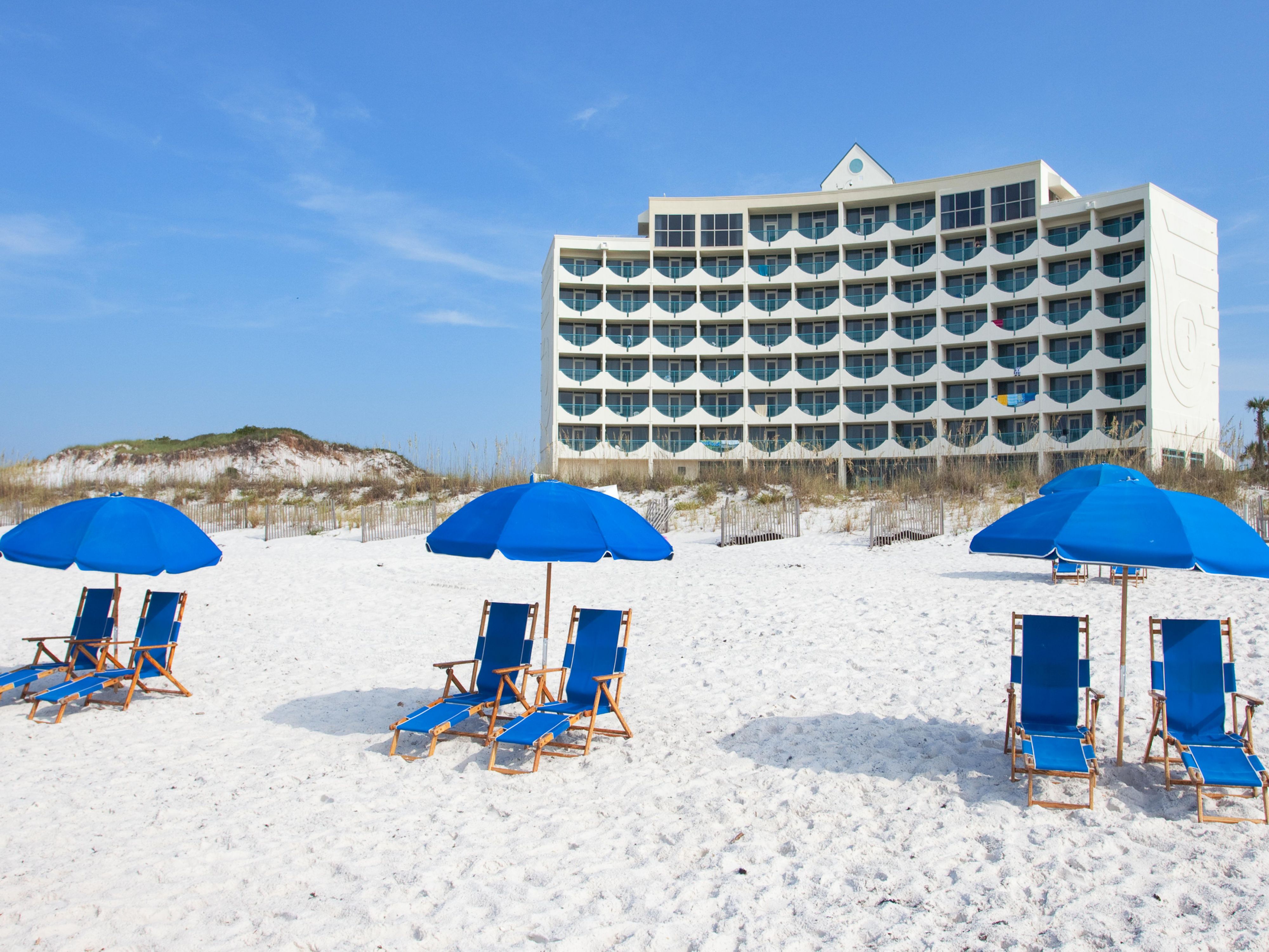 Beach chairs set up on the sand at Holiday Inn Express Pensacola Beach