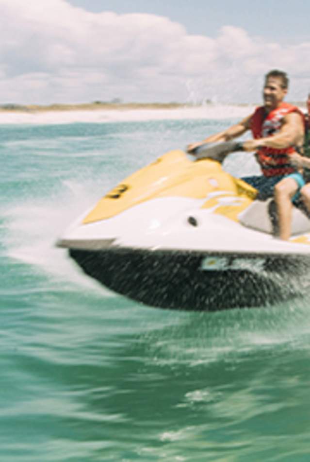 Jet ski riding on clear water in Panama City Beach