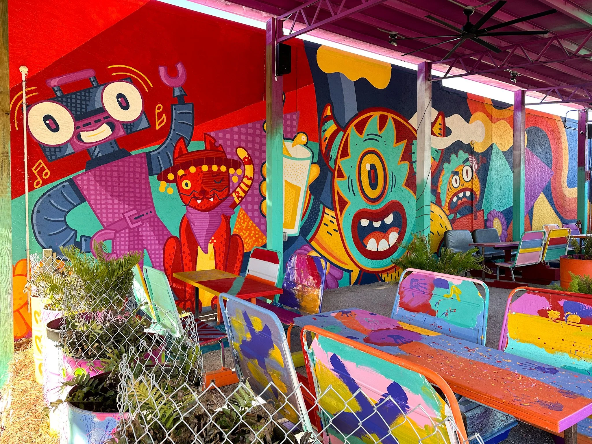 The mural-covered exterior of El Weirdo in downtown Panama City