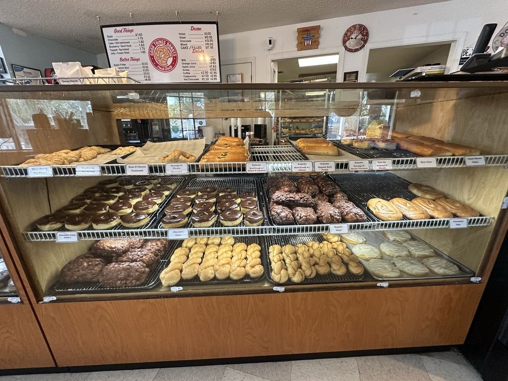 Display case of fresh donuts at Good Things Donuts in Crestview, Florida