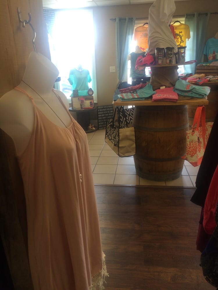 Clothing and accessories on display inside Katie Beth's Boutique in DeFuniak Springs