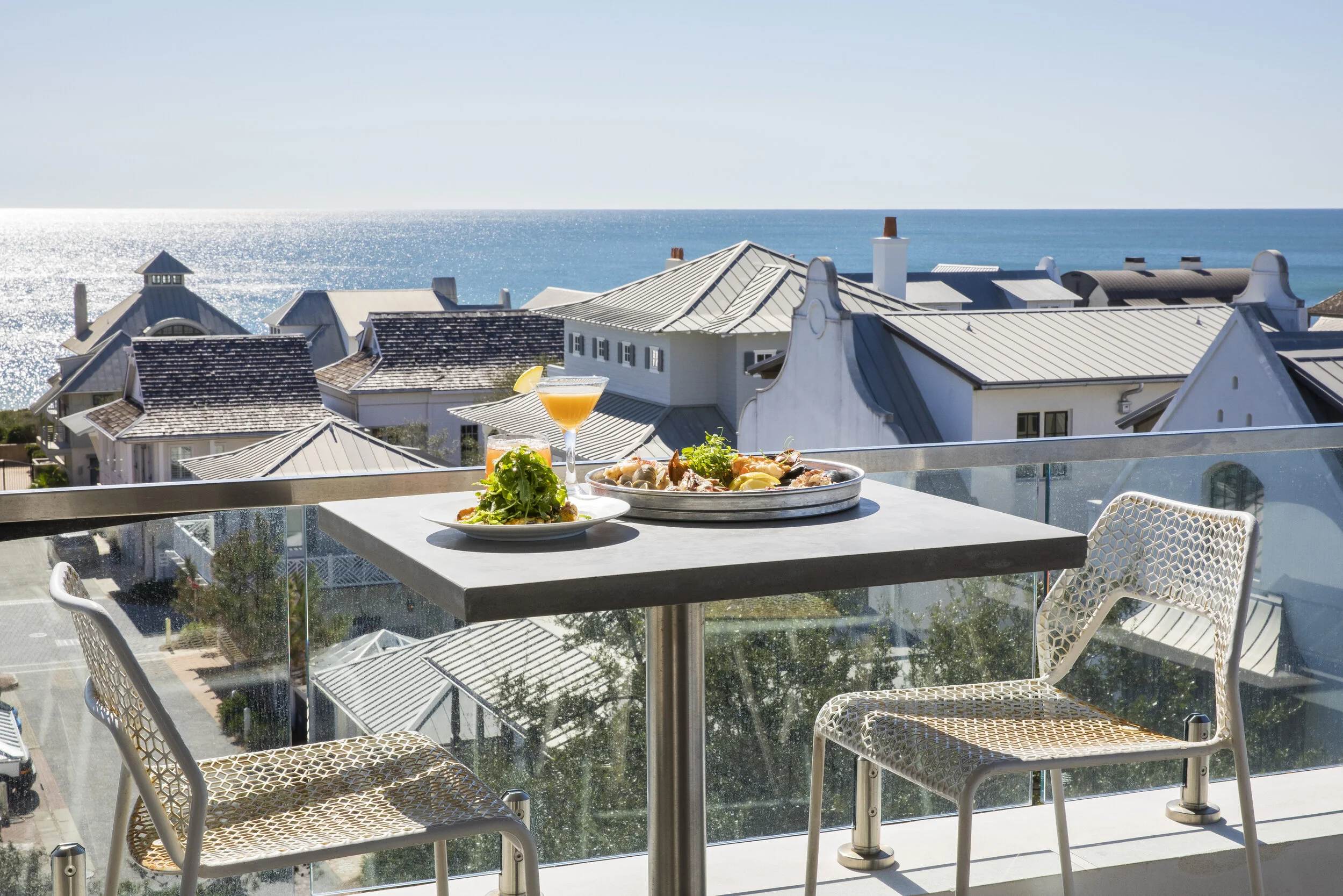 Guests dining at Pescado Seafood Grill & Rooftop Bar in Rosemary Beach