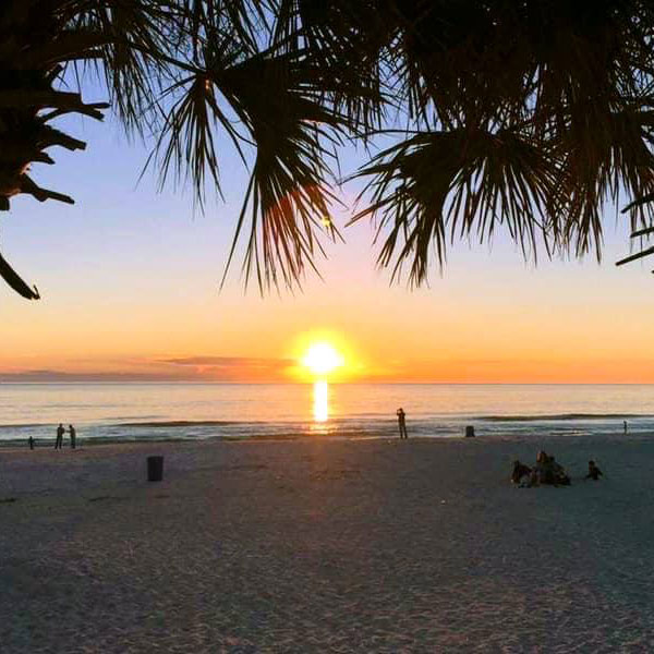Sunset over the Gulf at Schooners Last Local Beach Club