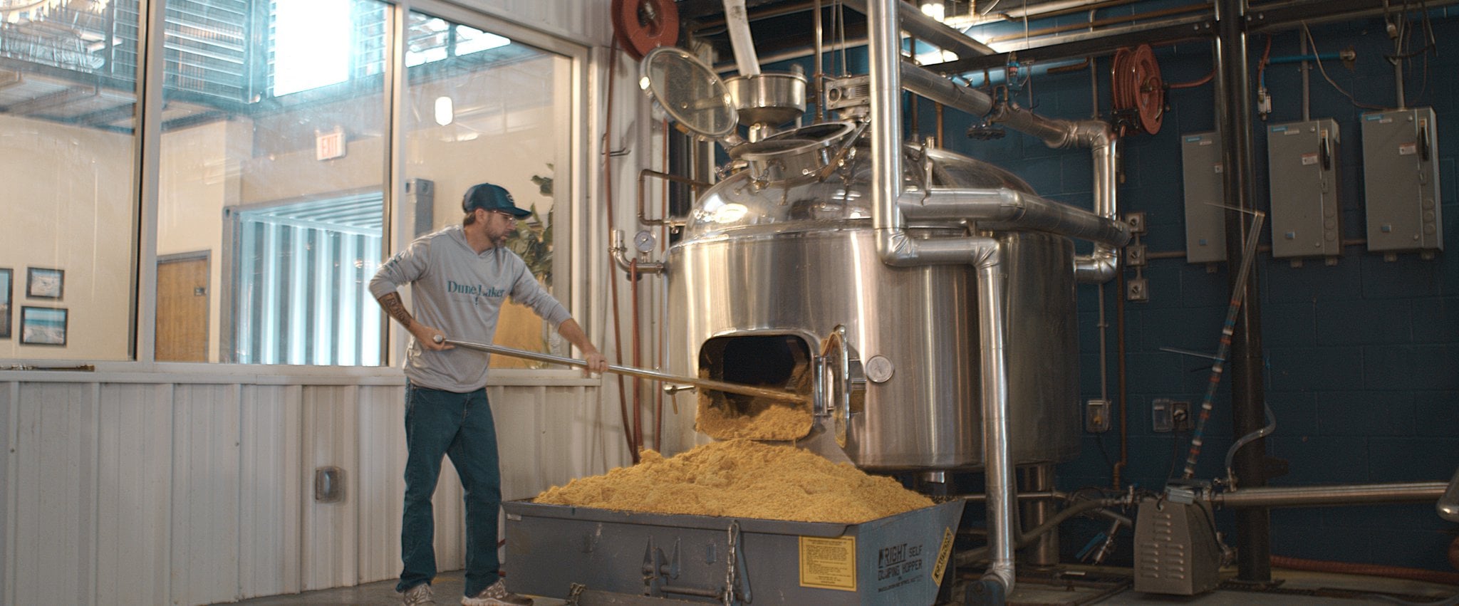 Shoveling Panhandle corn at Distillery 98 in Santa Rosa Beach