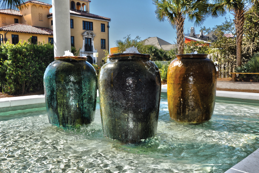 Outdoor patio dining area with fountains at Surfing Deer