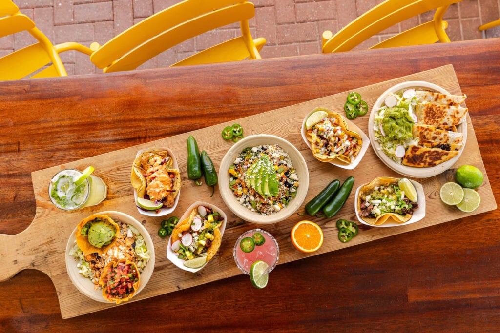 Colorful outdoor seating area at Bud & Alley's Taco Bar in Seaside