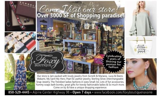 Clothing racks and new arrivals display inside Foxy Boutique in Navarre