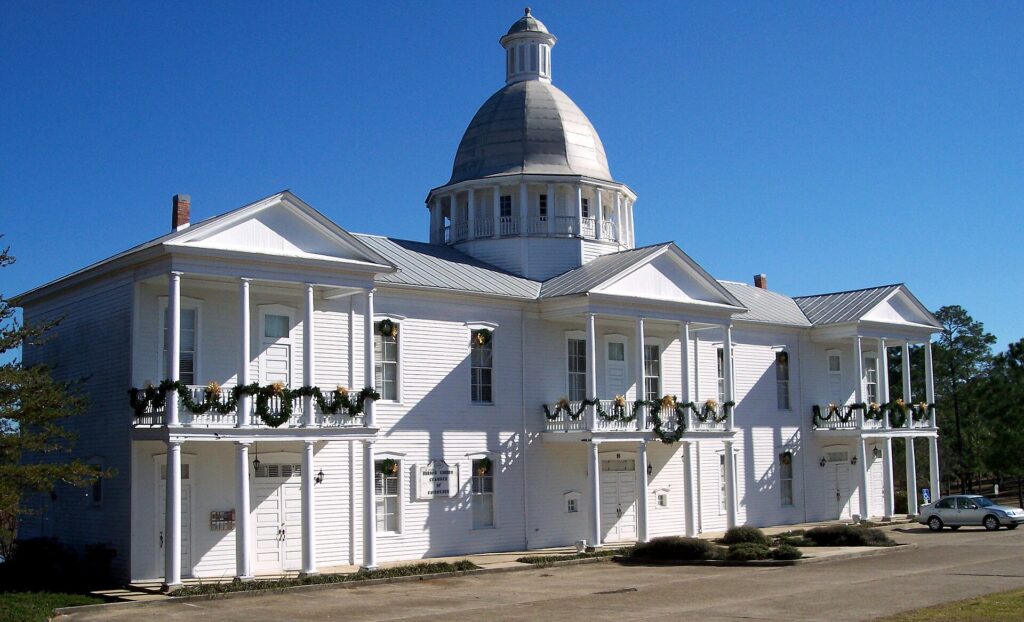 The Chautauqua Hall of Brotherhood's white domed building on Lake DeFuniak in DeFuniak Springs