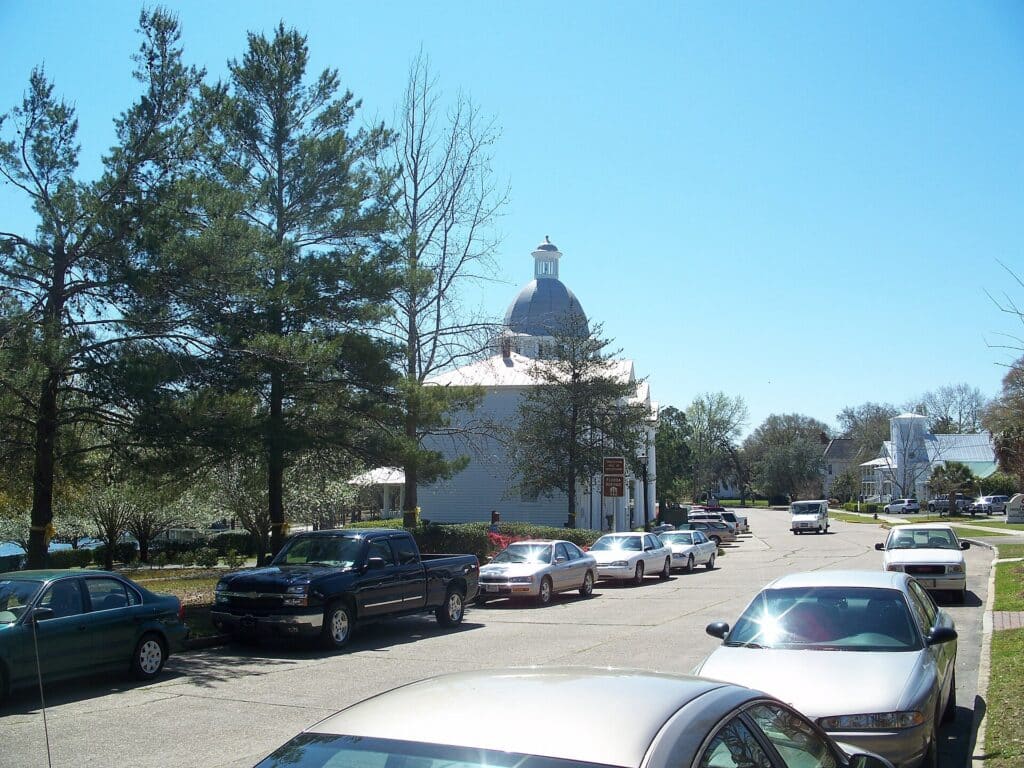 Street in the DeFuniak Springs historic district with the Chautauqua Hall dome in the distance