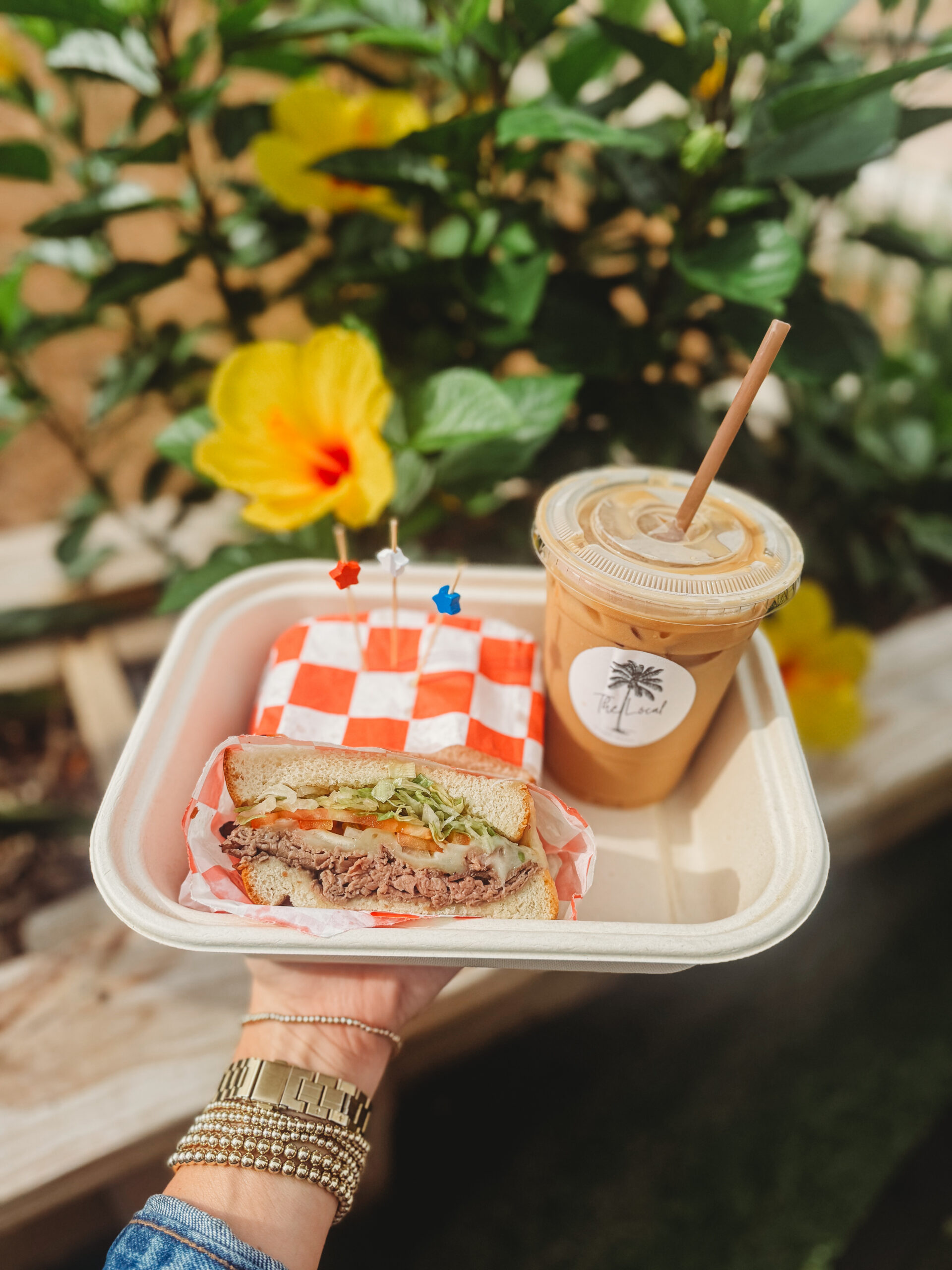 A deli sandwich and iced coffee from The Local on Pensacola Beach