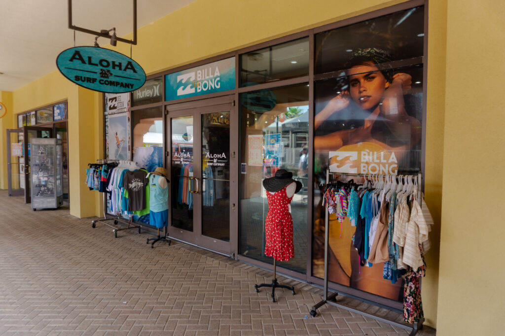 Storefront and clothing displays at Aloha Surf Company in HarborWalk Village, Destin