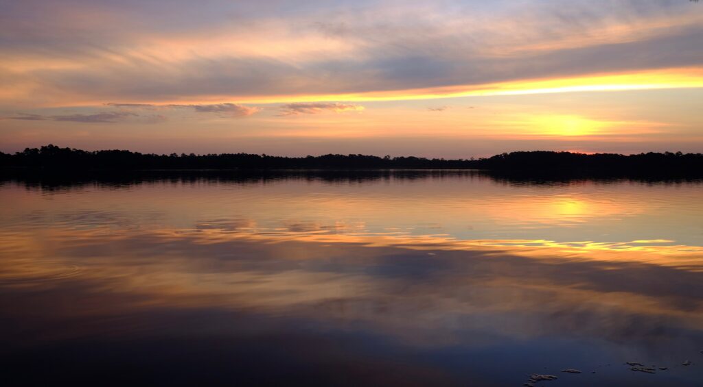 Sunrise over the water at Fred Gannon Rocky Bayou State Park in Niceville, Florida