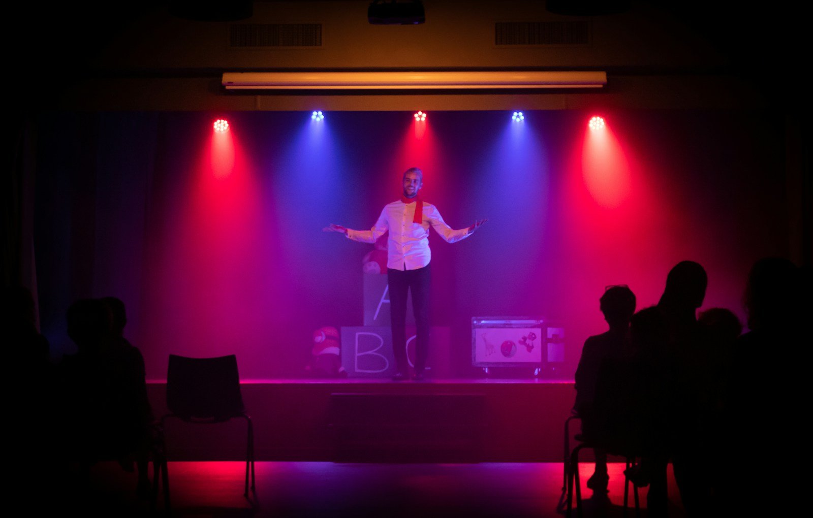 Performer at the microphone on a small club stage