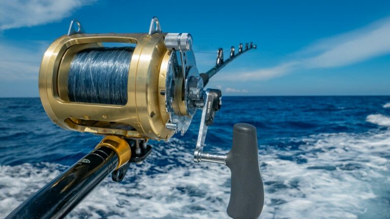Fishing reel on a boat over open water