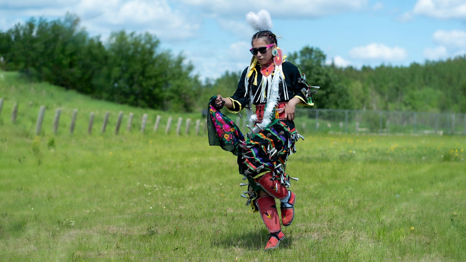 Dancer in traditional regalia at a powwow